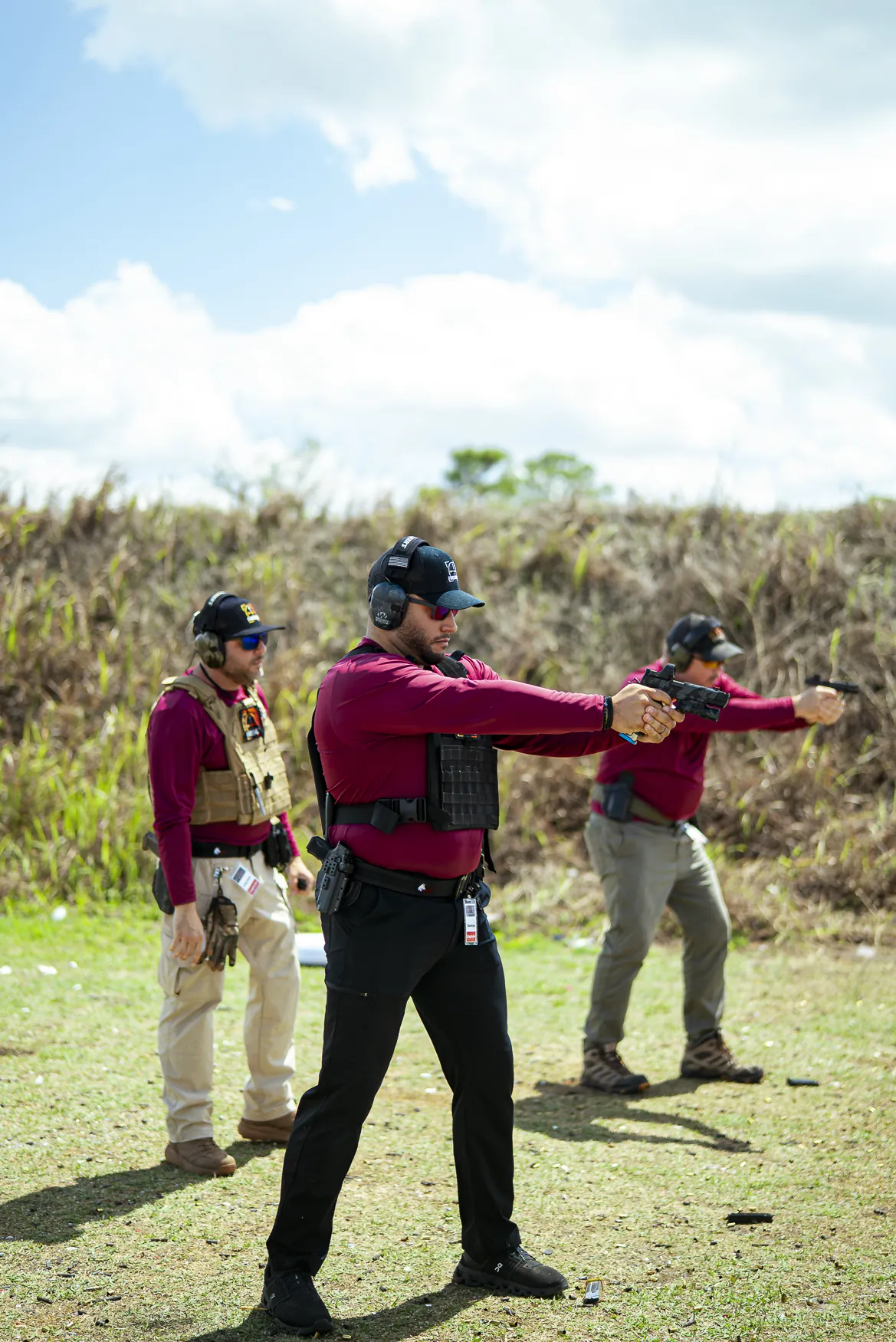 A man fires on the pistol line at a Fireside event